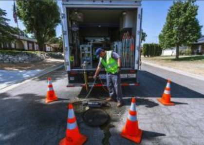 JCSD truck and sewer work man with truck working on sewer