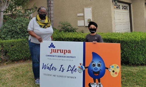 gp1 two people holding sign