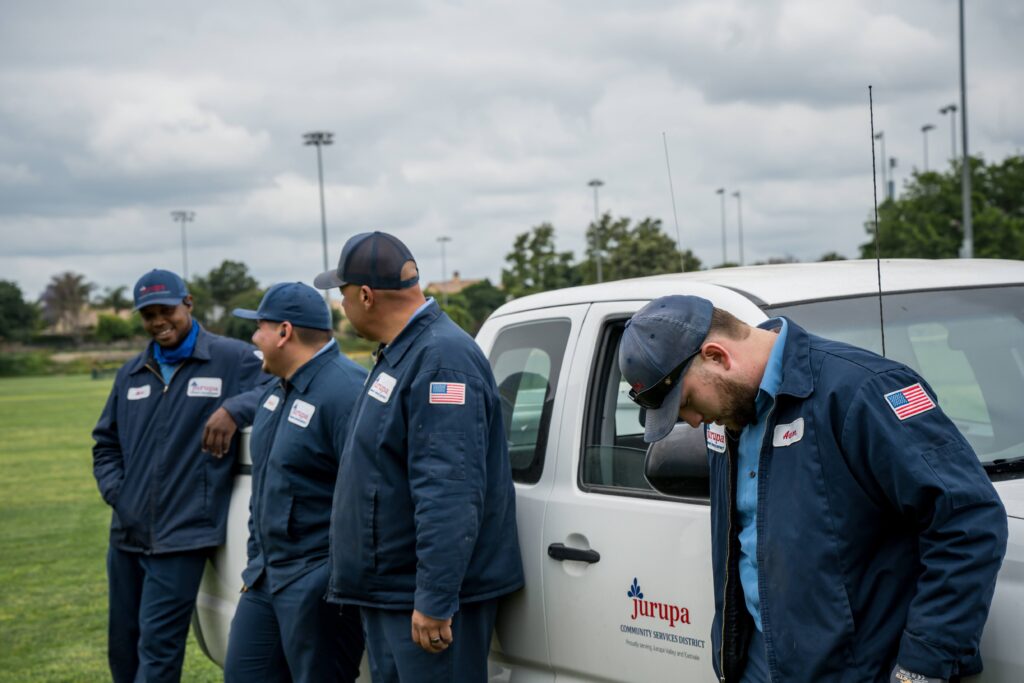 Maintenance Crew Workers stand beside each other